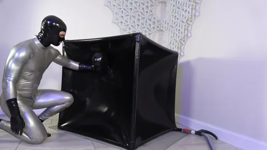 Hugh Mungus Is Helping Lara Into The Vac Cube