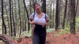 Playing in the woods with a glass dildo 