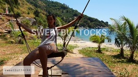 Rides on a swing without panties on the beach of Thailand