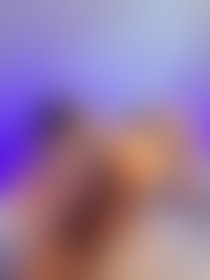 a woman wearing glasses and lingerie on a bed with leopard print sheets and pillows in the background - post hidden image