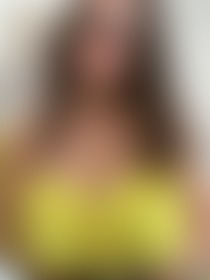 Cleavage in a yellow top - post hidden image