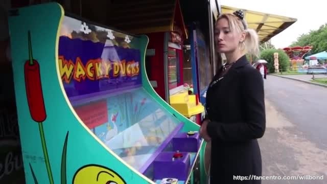 Sofi Bondage walk in handcuffs in an amusement park 1 background